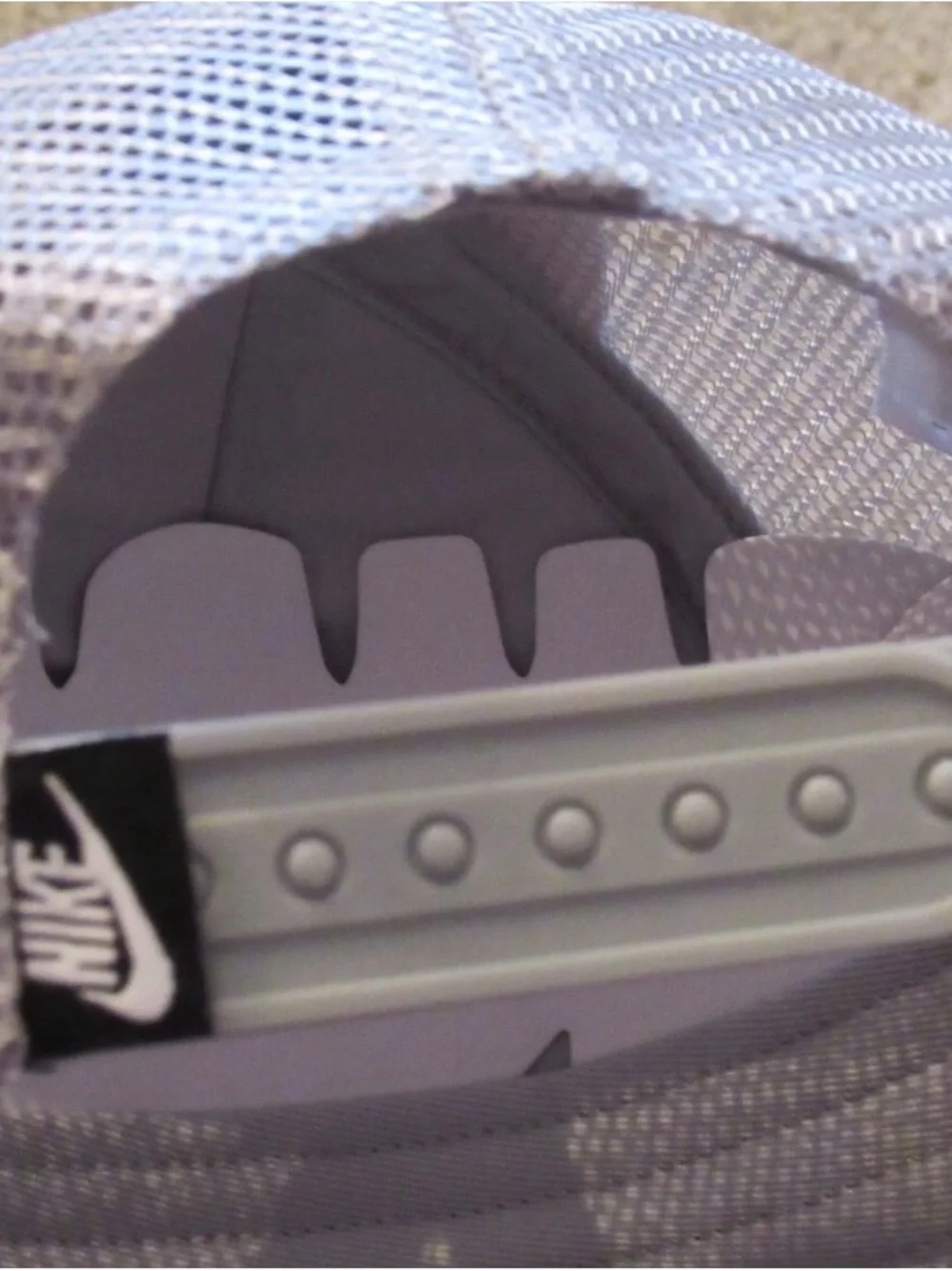 Nike Silver Mesh Trucker Hat with Black Logo Tag